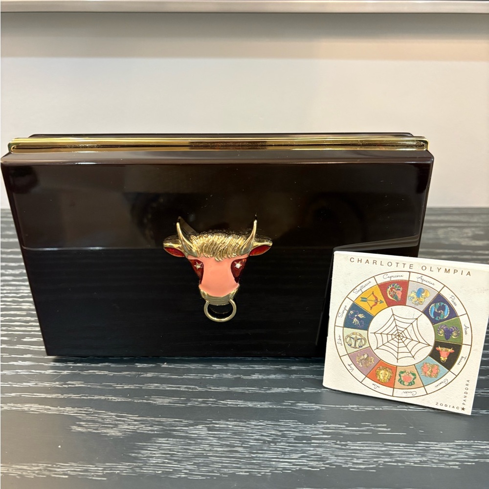 Charlotte Olympia Maroon Taurus Clutch with Gold Details